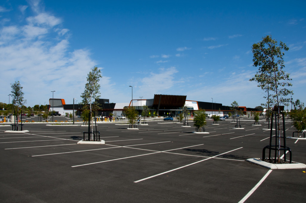 large empty parking lot in shopping plaza